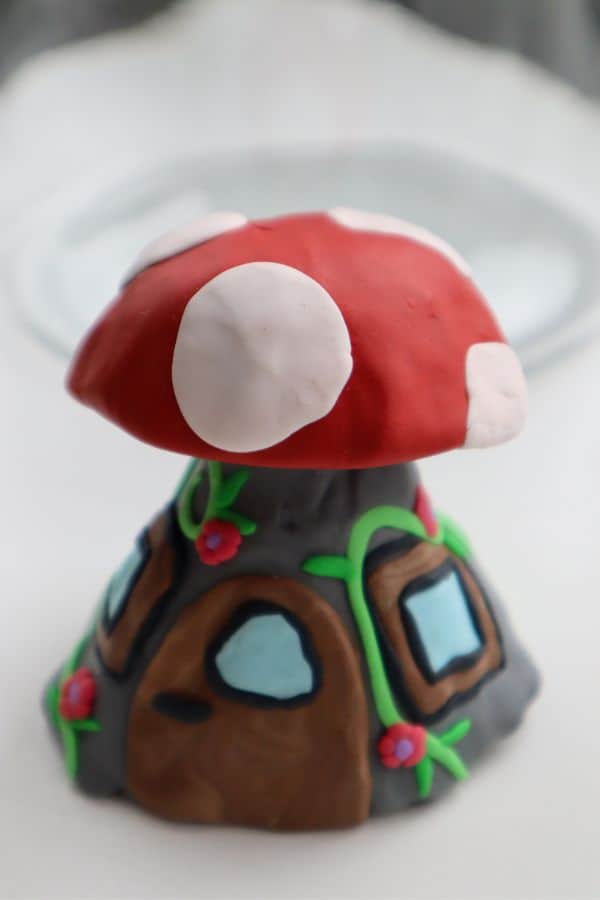 mushroom-inspired fairy house made with polymer clay